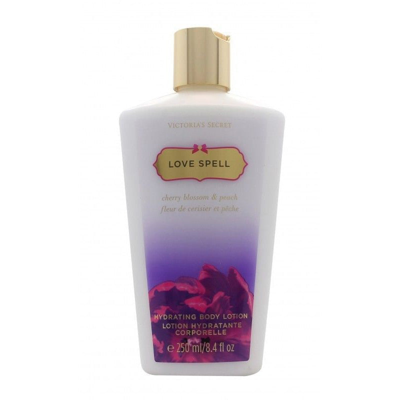 Victoria's Secret Love Spell Body Lotion bottle with floral design, showcasing its luxurious packaging.