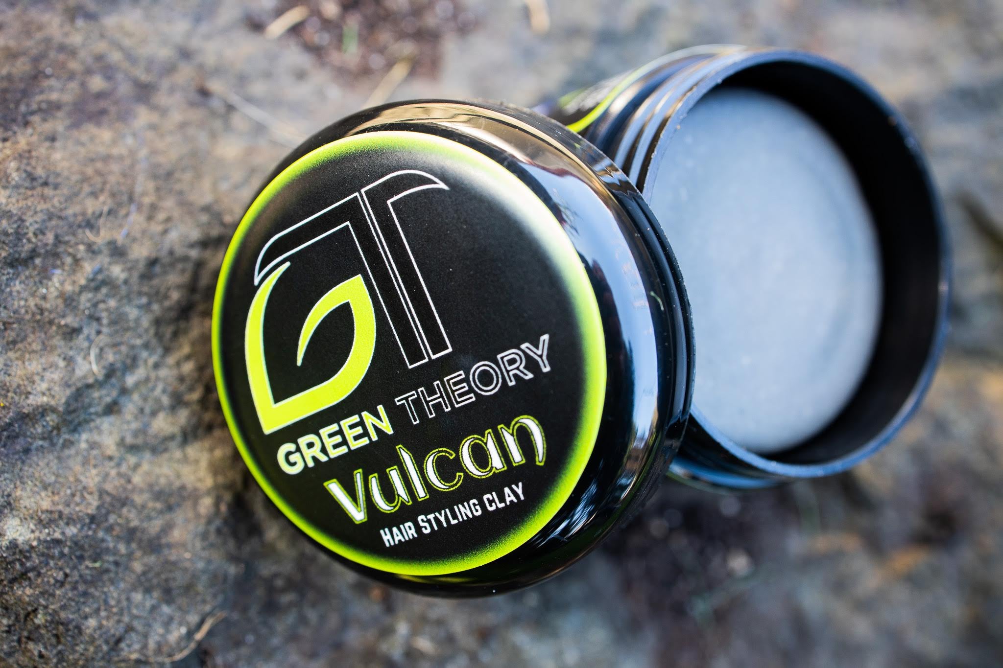 Vulcan Natural Hair Styling Clay in a stylish container, showcasing its natural ingredients and texture.