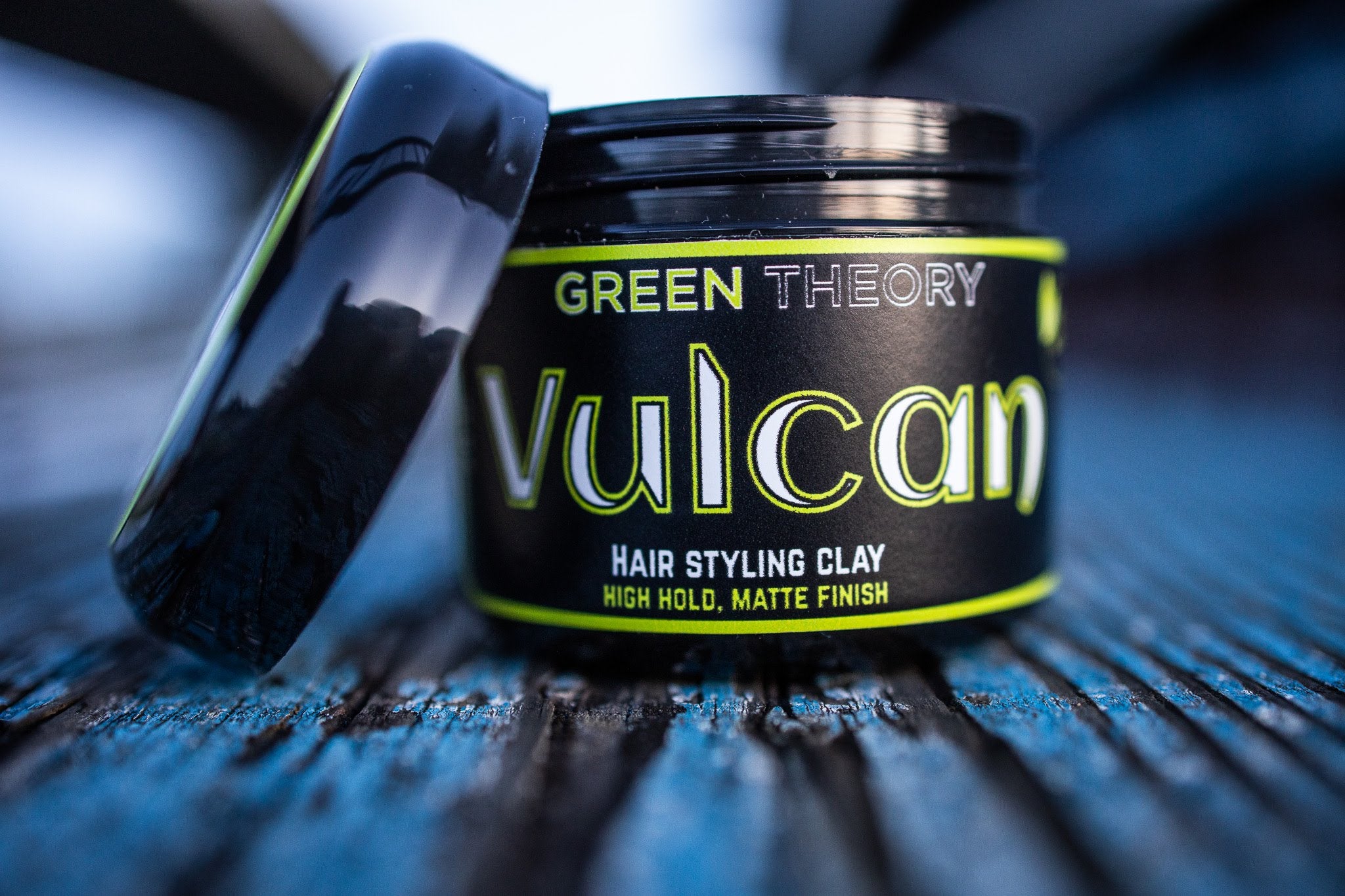 Vulcan Natural Hair Styling Clay in a stylish container, showcasing its natural ingredients and texture.