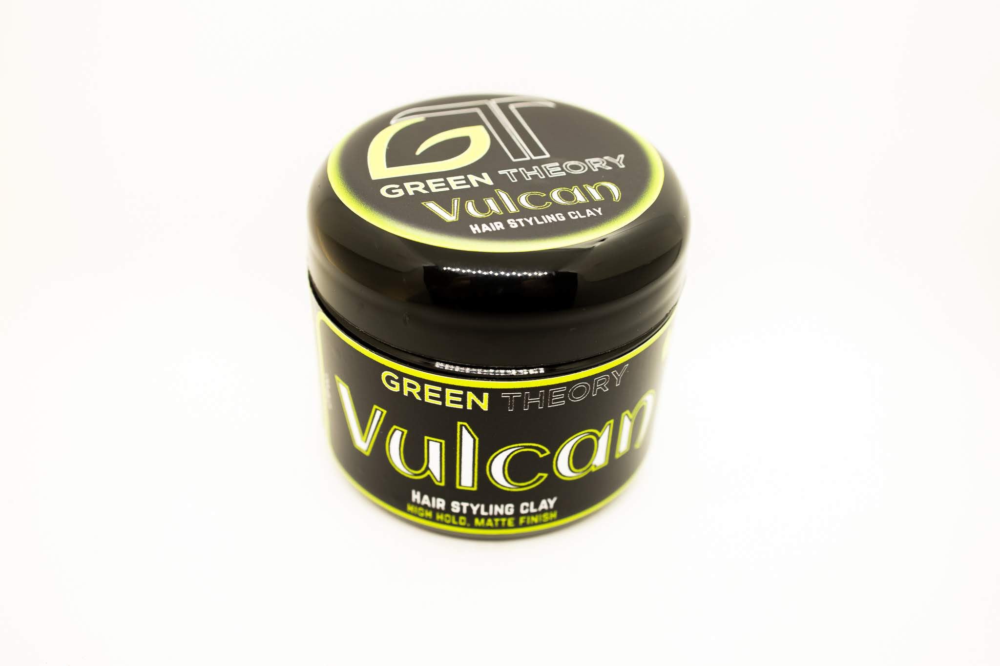 Vulcan Natural Hair Styling Clay in a stylish container, showcasing its natural ingredients and texture.