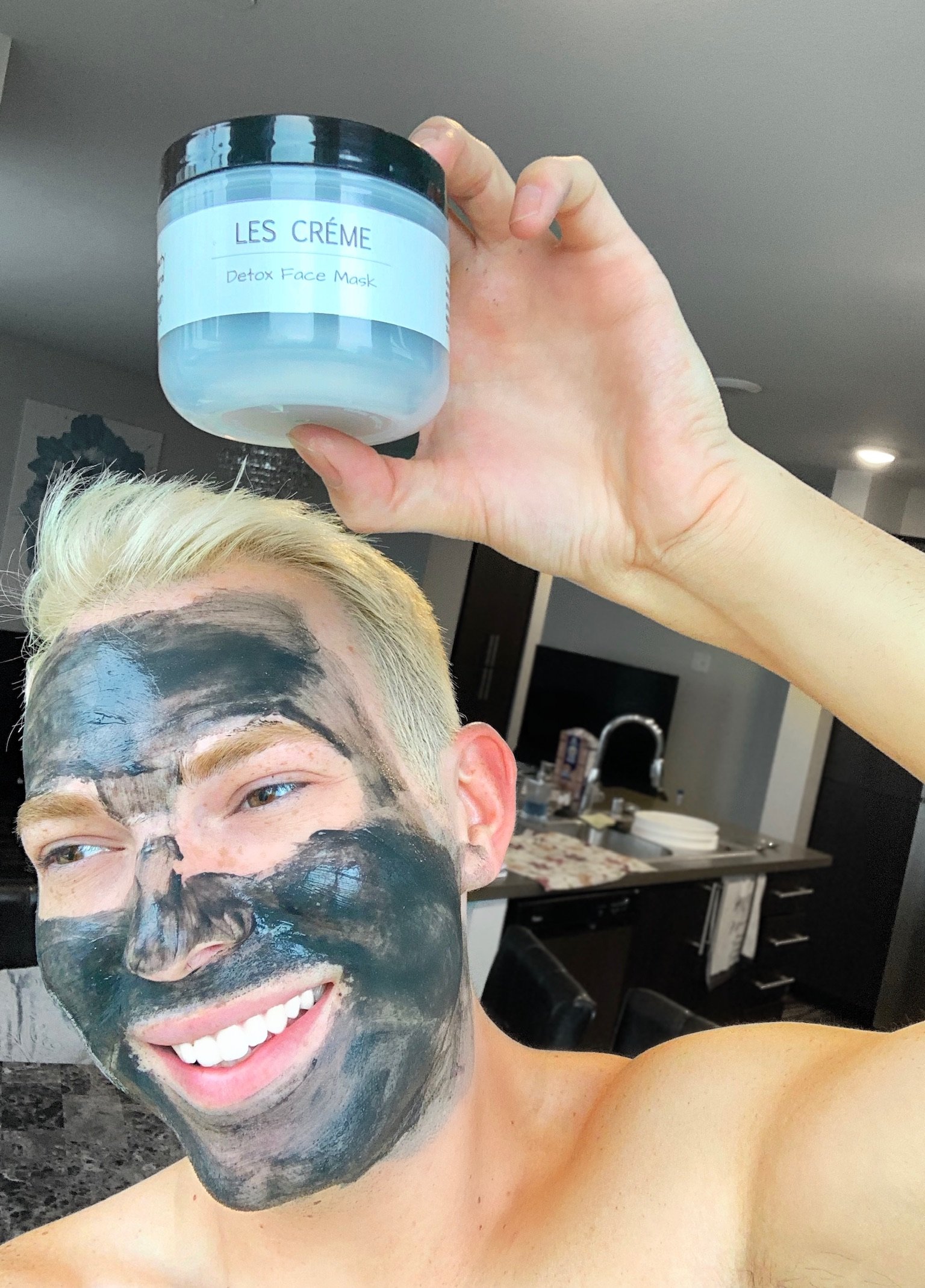 A jar of Weekly Detox Facial Mask with activated coconut charcoal and bentonite clay, showcasing its creamy texture and natural ingredients.