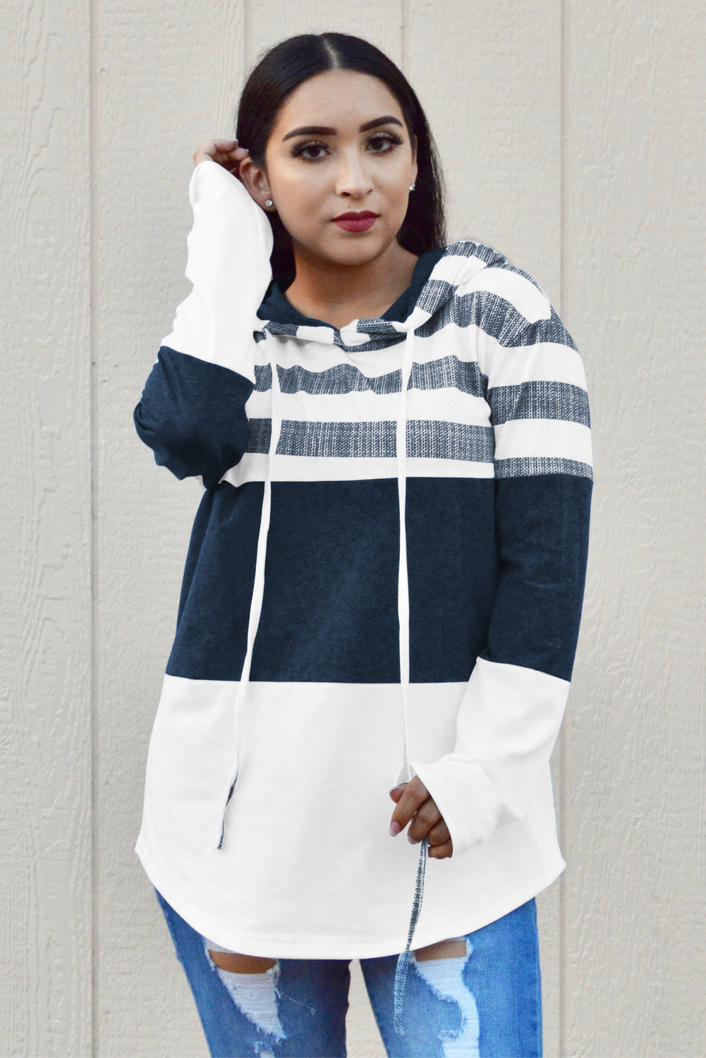 A stylish white color block drawstring hoodie featuring a classic pullover design with striped prints, perfect for casual wear.