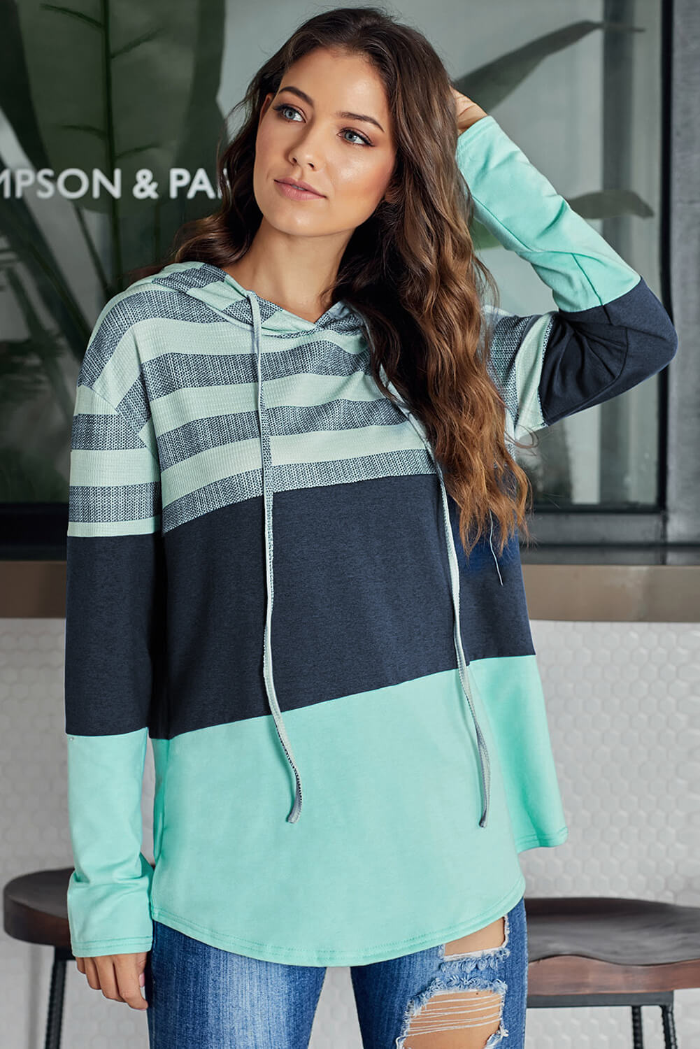 A stylish white color block drawstring hoodie featuring a classic pullover design with striped prints, perfect for casual wear.