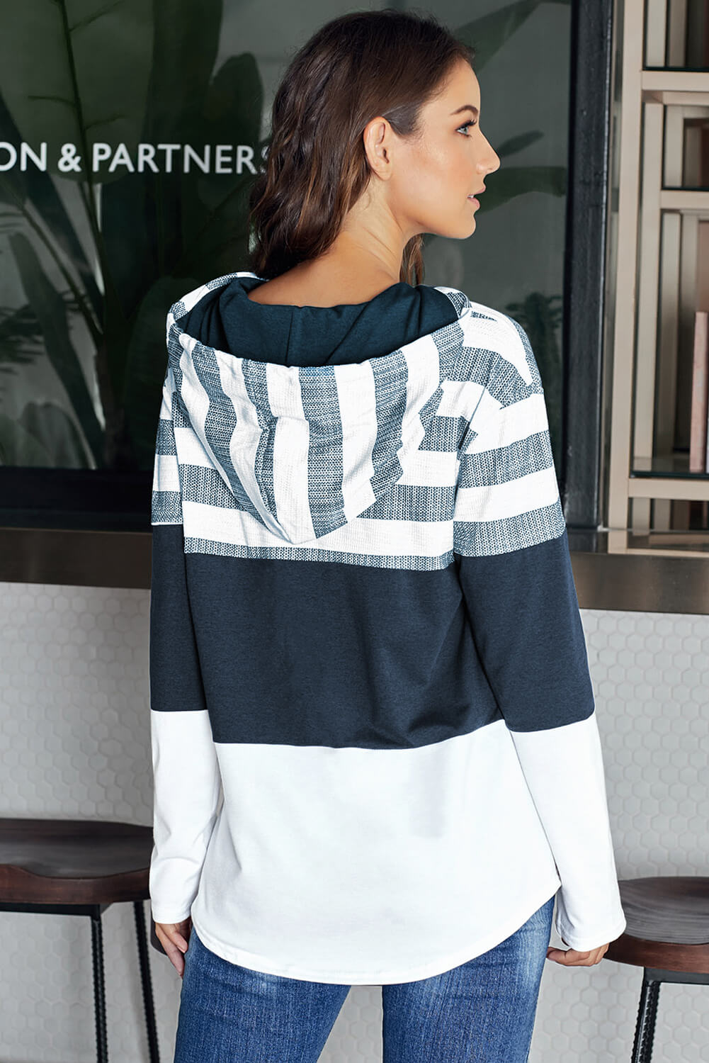 A stylish white color block drawstring hoodie featuring a classic pullover design with striped prints, perfect for casual wear.