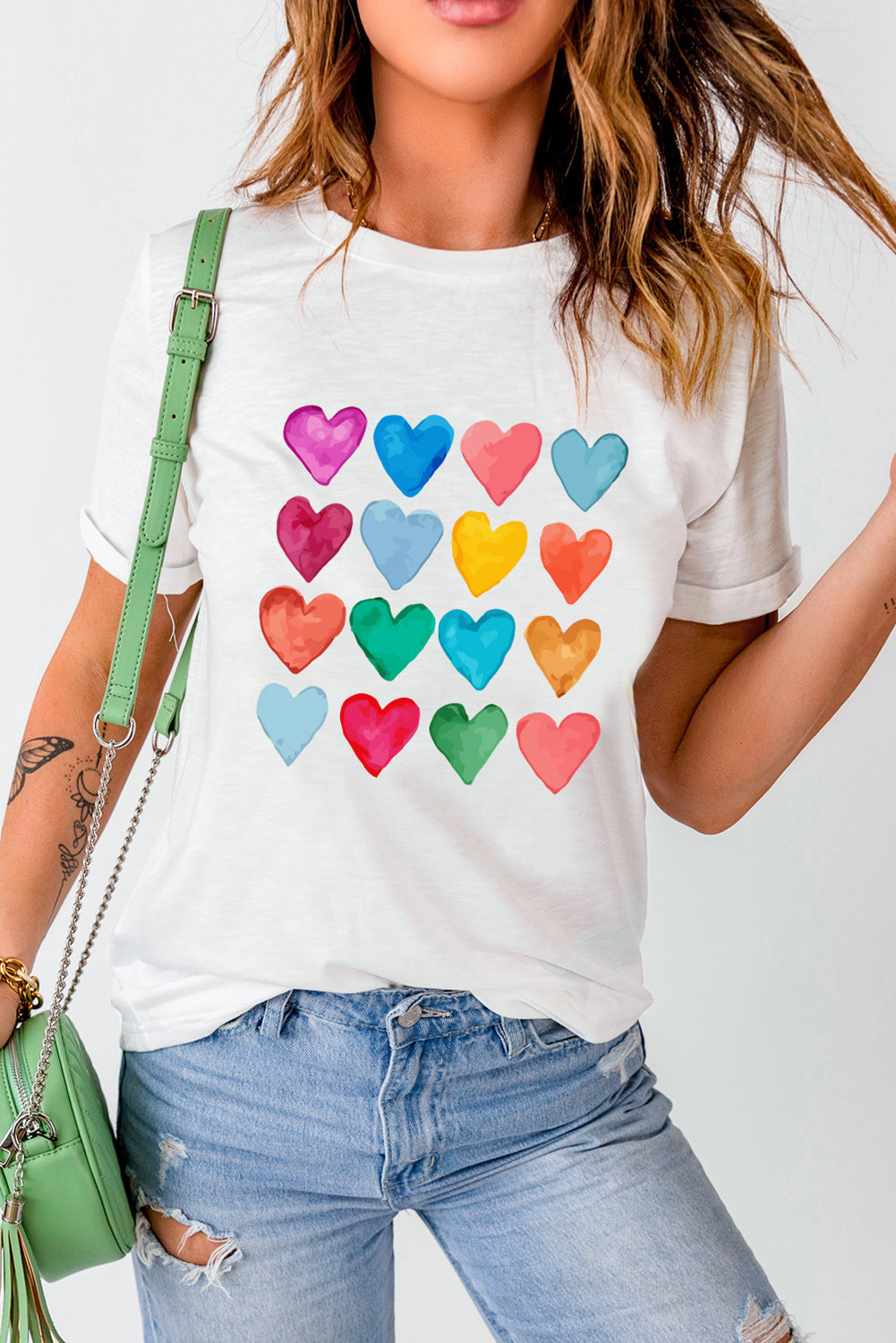 White crew neck T-shirt featuring colorful heart-shaped prints, perfect for summer and Valentine's Day.