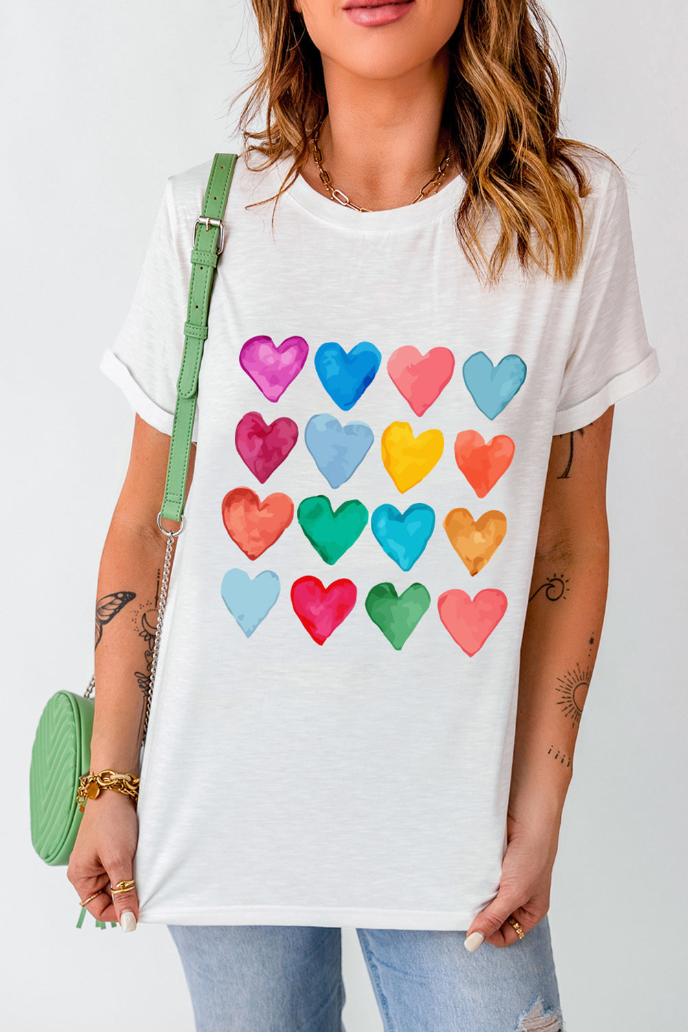 White crew neck T-shirt featuring colorful heart-shaped prints, perfect for summer and Valentine's Day.