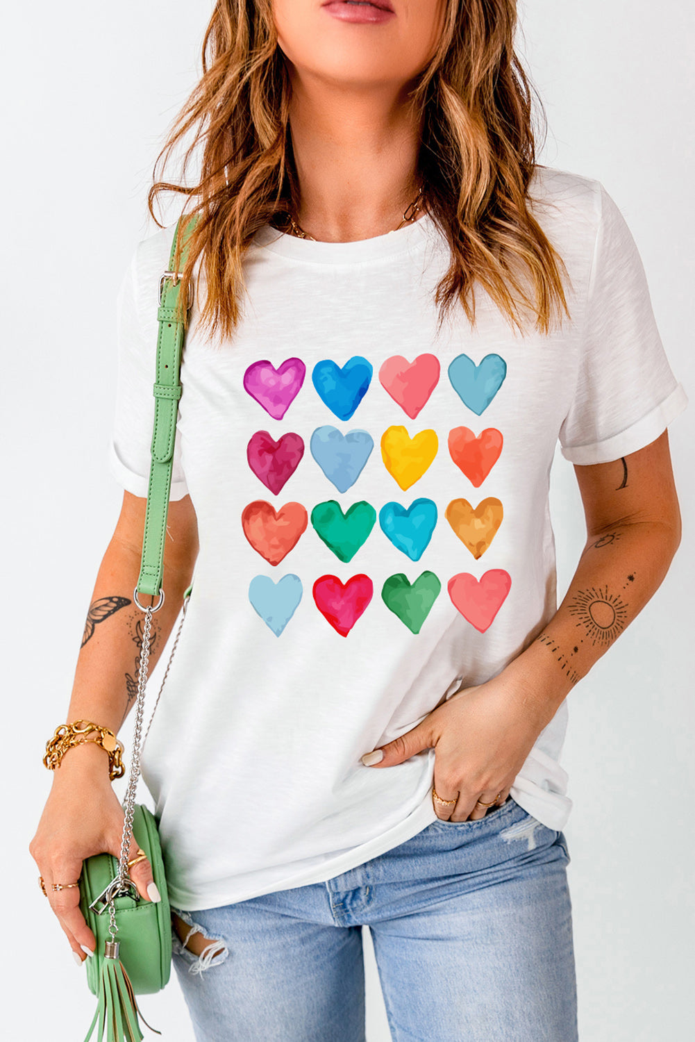 White crew neck T-shirt featuring colorful heart-shaped prints, perfect for summer and Valentine's Day.