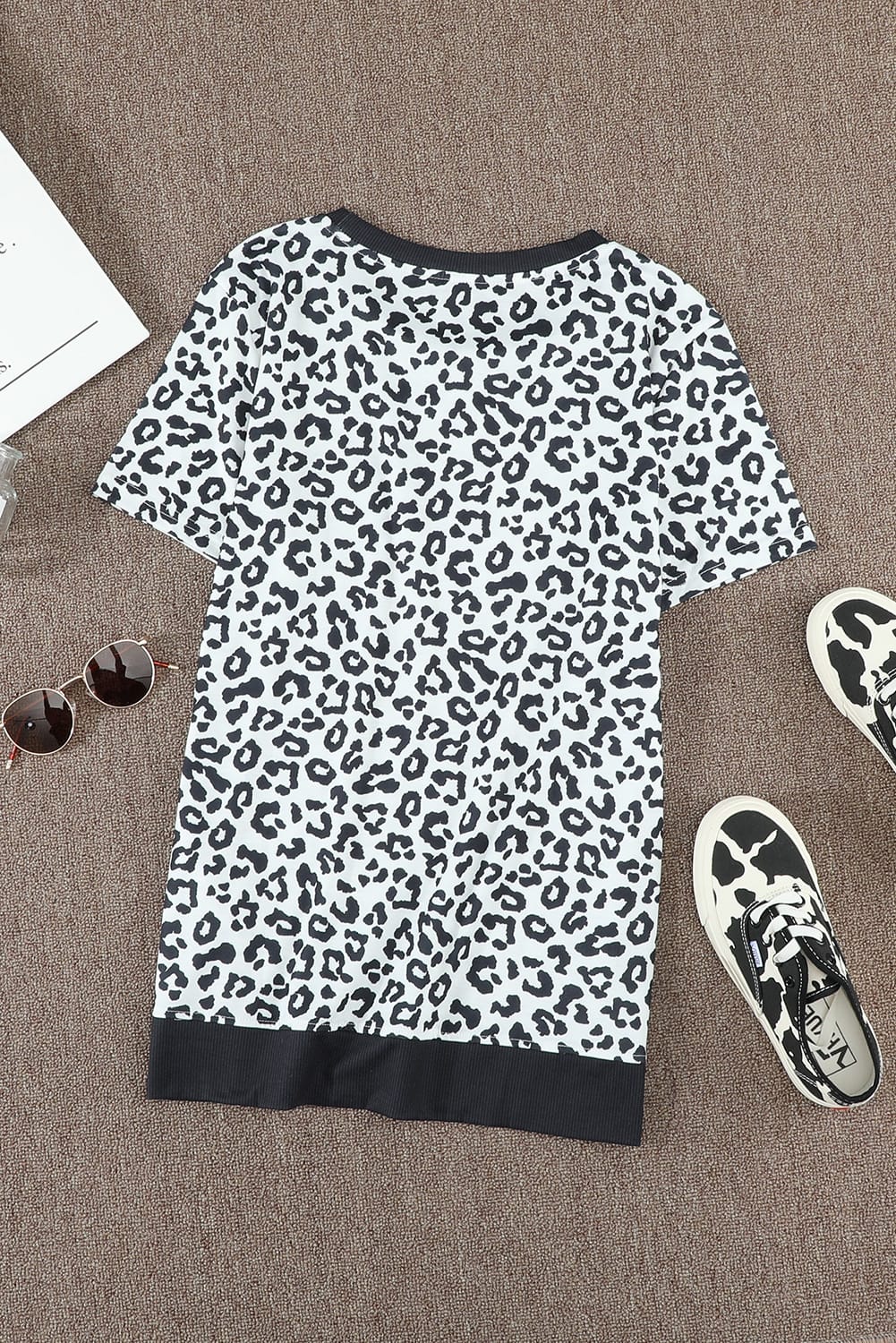 White Crew Neck T-shirt featuring a leopard print design on the sides and a stylish split, perfect for casual wear.