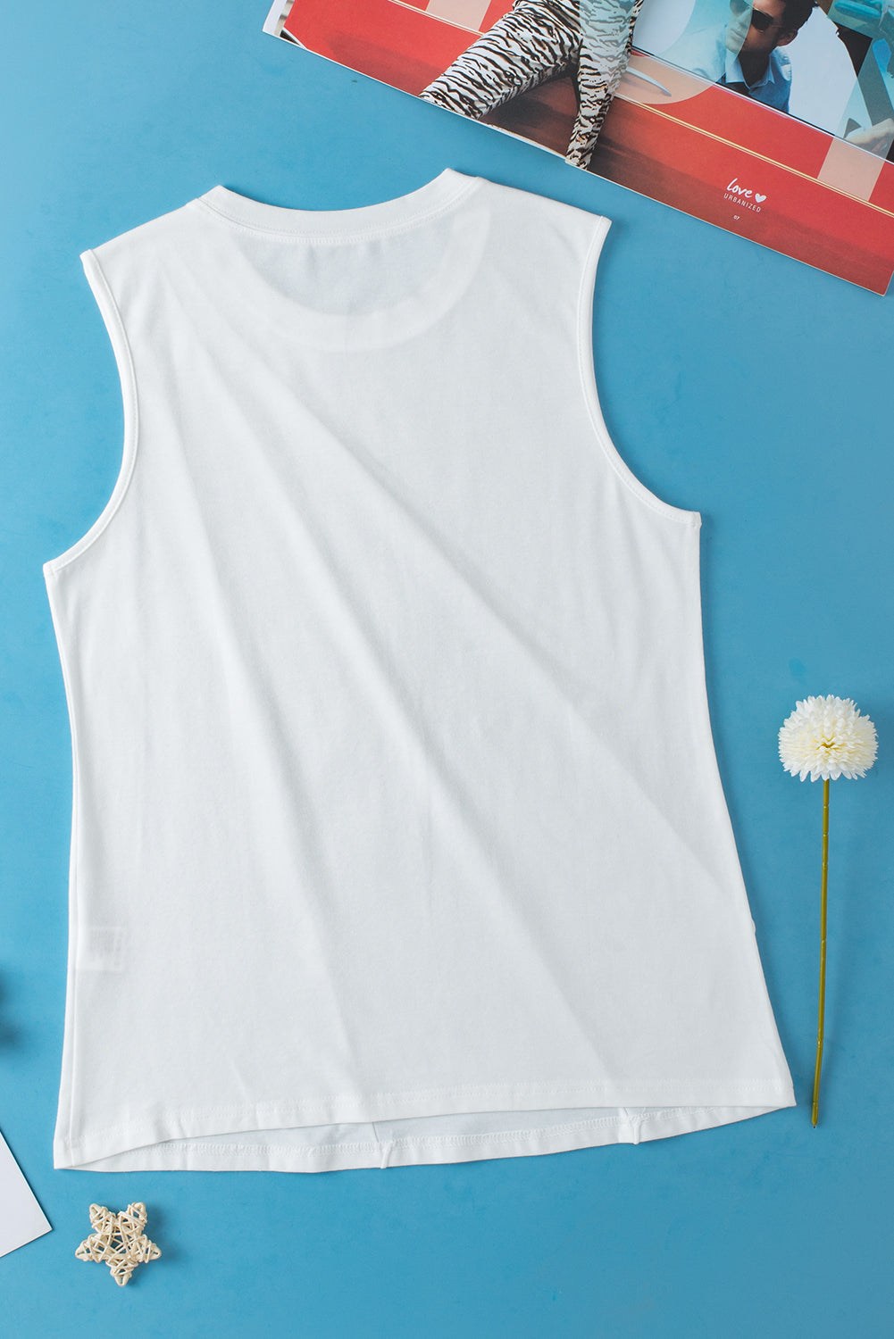 A stylish white crew neck pleated tank top displayed on a mannequin, showcasing its elegant design and pleated details.