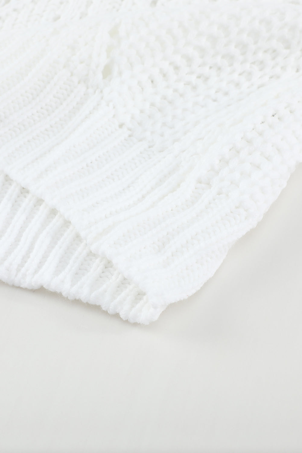 A stylish white crewneck sweater with balloon sleeves, featuring a textured knit design, perfect for casual wear.