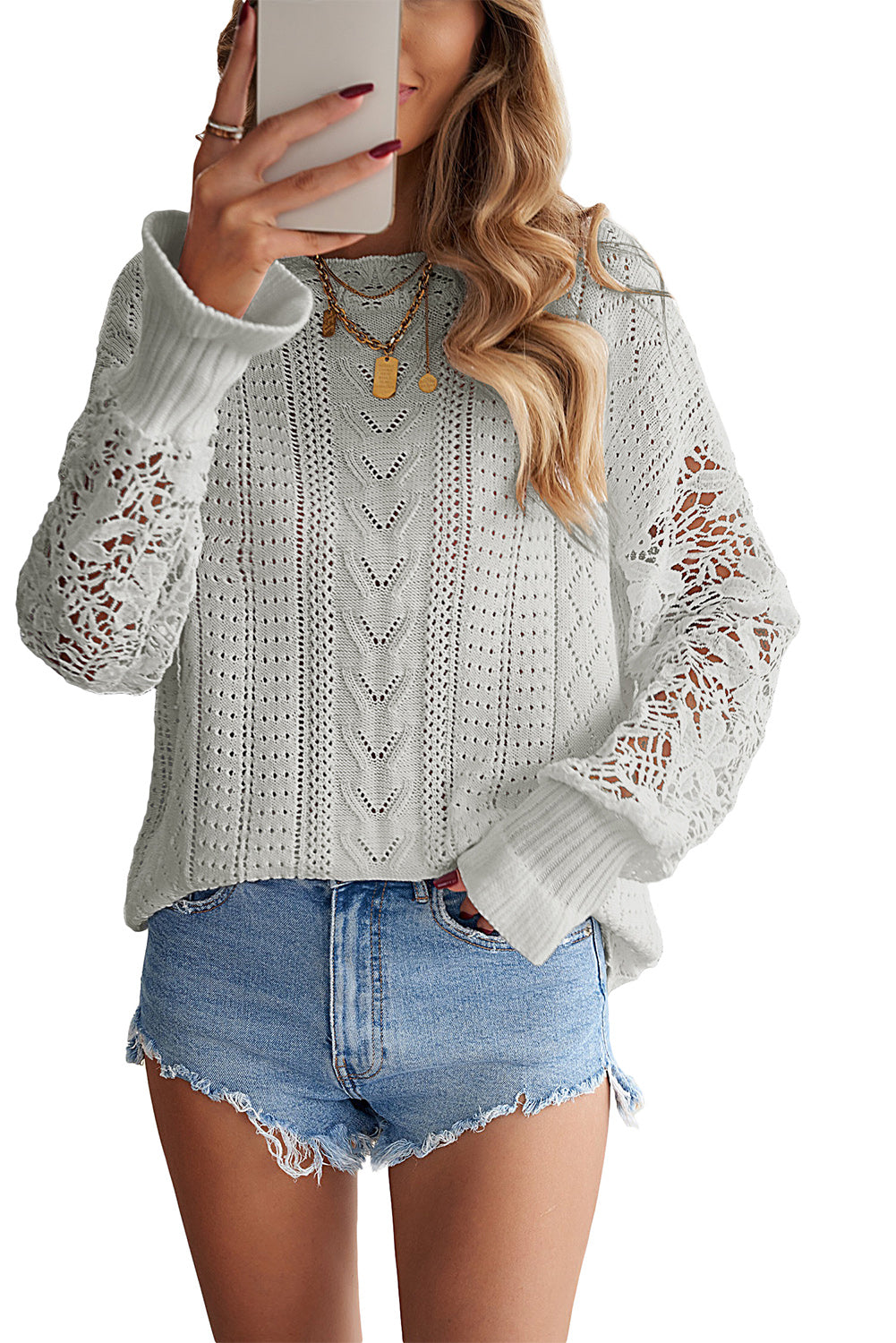 A stylish white crochet lace pointelle knit sweater featuring a scalloped neckline and sheer lace sleeves, perfect for casual and chic outfits.