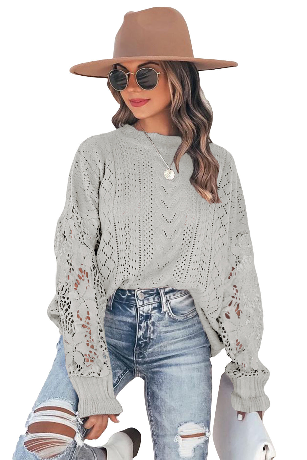 A stylish white crochet lace pointelle knit sweater featuring a scalloped neckline and sheer lace sleeves, perfect for casual and chic outfits.