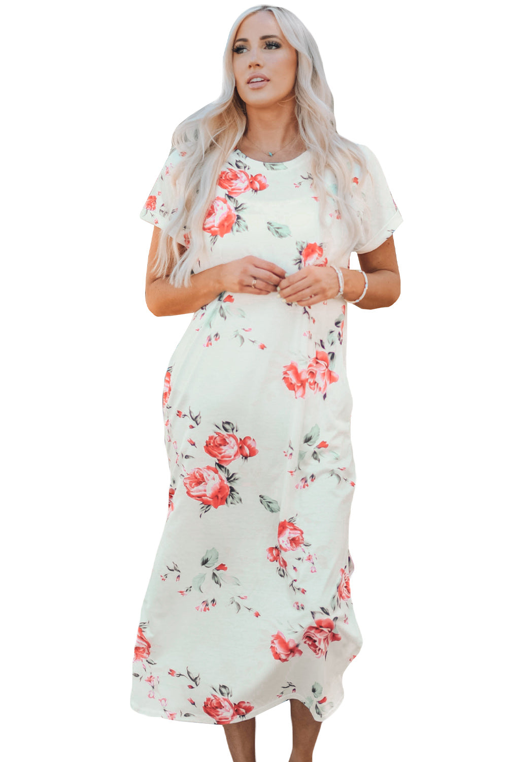 A stylish white t shirt dress featuring a vibrant floral print, side slits, and short sleeves, perfect for summer outings.