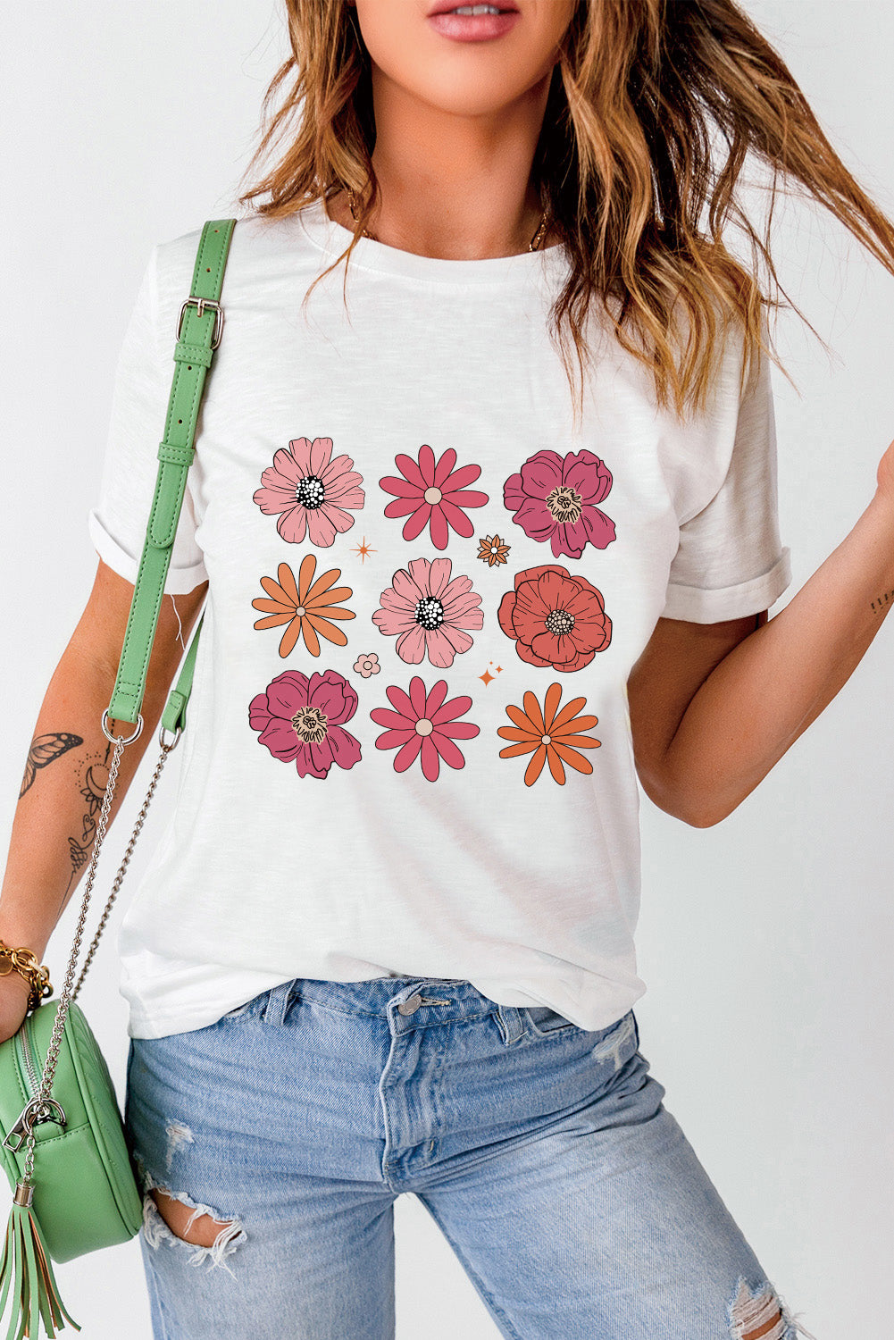 A stylish White Flower Graphic Crewneck T Shirt featuring a delicate floral design, perfect for casual wear.