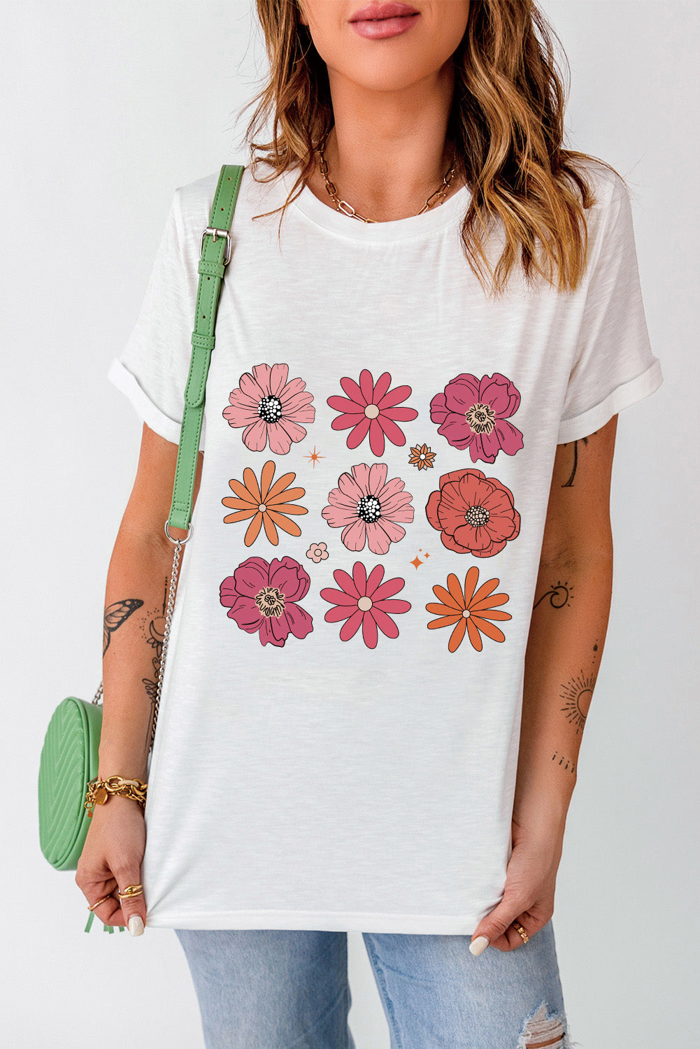 A stylish White Flower Graphic Crewneck T Shirt featuring a delicate floral design, perfect for casual wear.