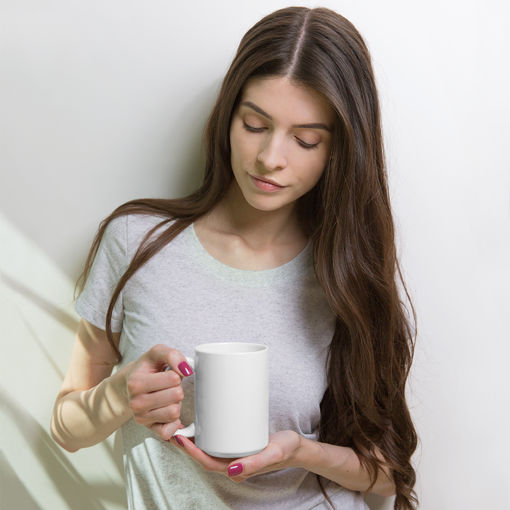 A white glossy ceramic mug with a vibrant print, ideal for coffee and tea.