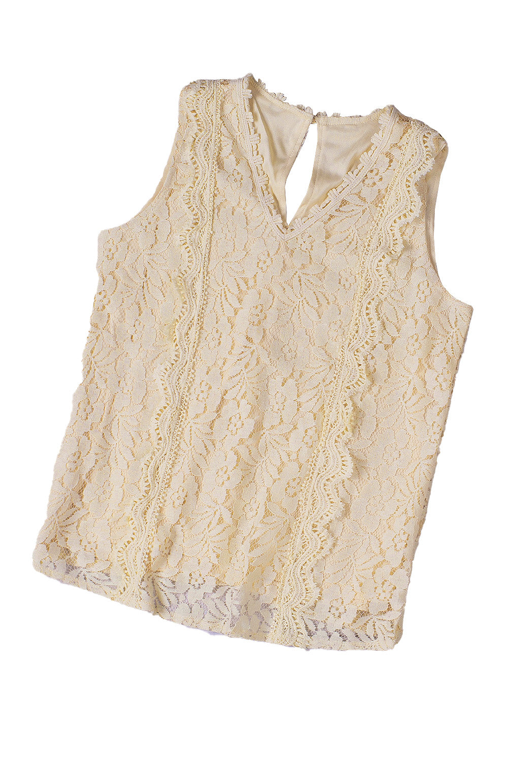 A stylish white lace v neck tank top featuring a delicate floral lace design, sleeveless cut, and a daring hollow-out back.