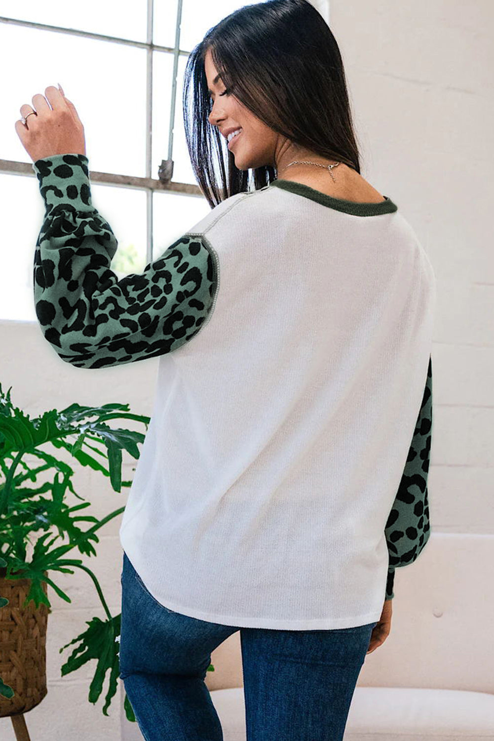 White Leopard Colorblock Patchwork Knit Top featuring a stylish design with leopard print and a relaxed fit, perfect for casual outings.