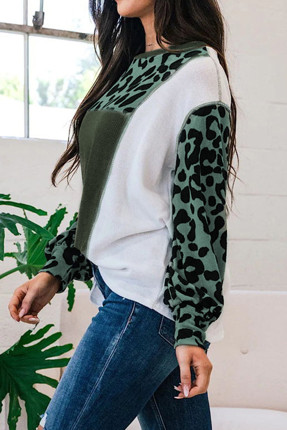 White Leopard Colorblock Patchwork Knit Top featuring a stylish design with leopard print and a relaxed fit, perfect for casual outings.