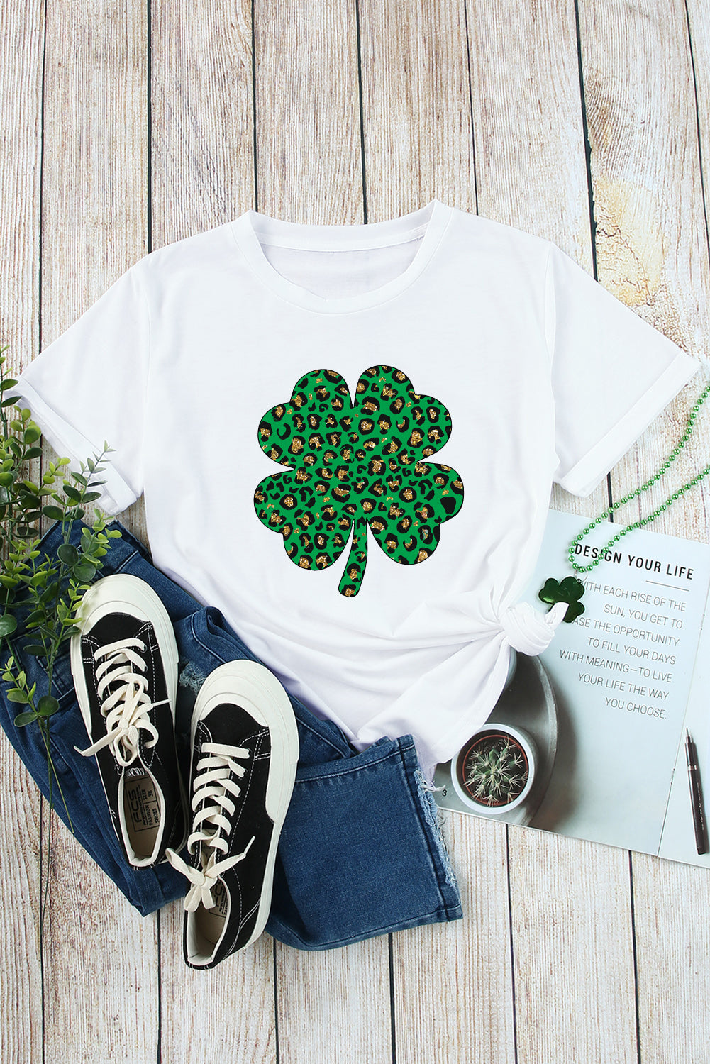 White Leopard Four Leaf Clover Graphic Tee featuring a stylish leopard print and four-leaf clover design.