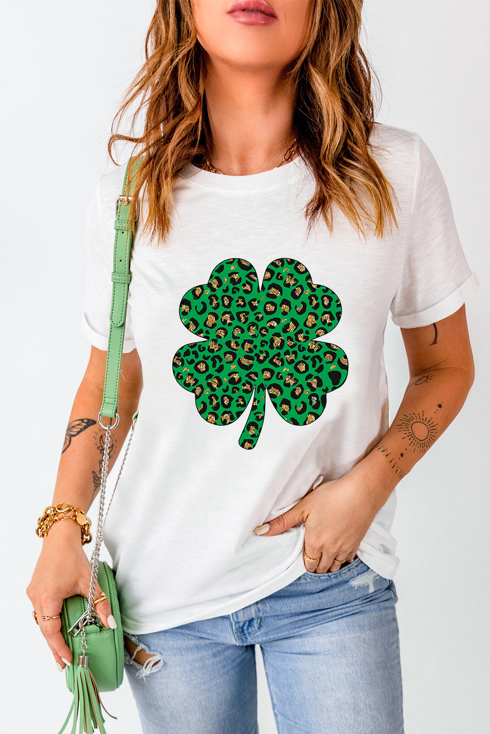 White Leopard Four Leaf Clover Graphic Tee featuring a stylish leopard print and four-leaf clover design.