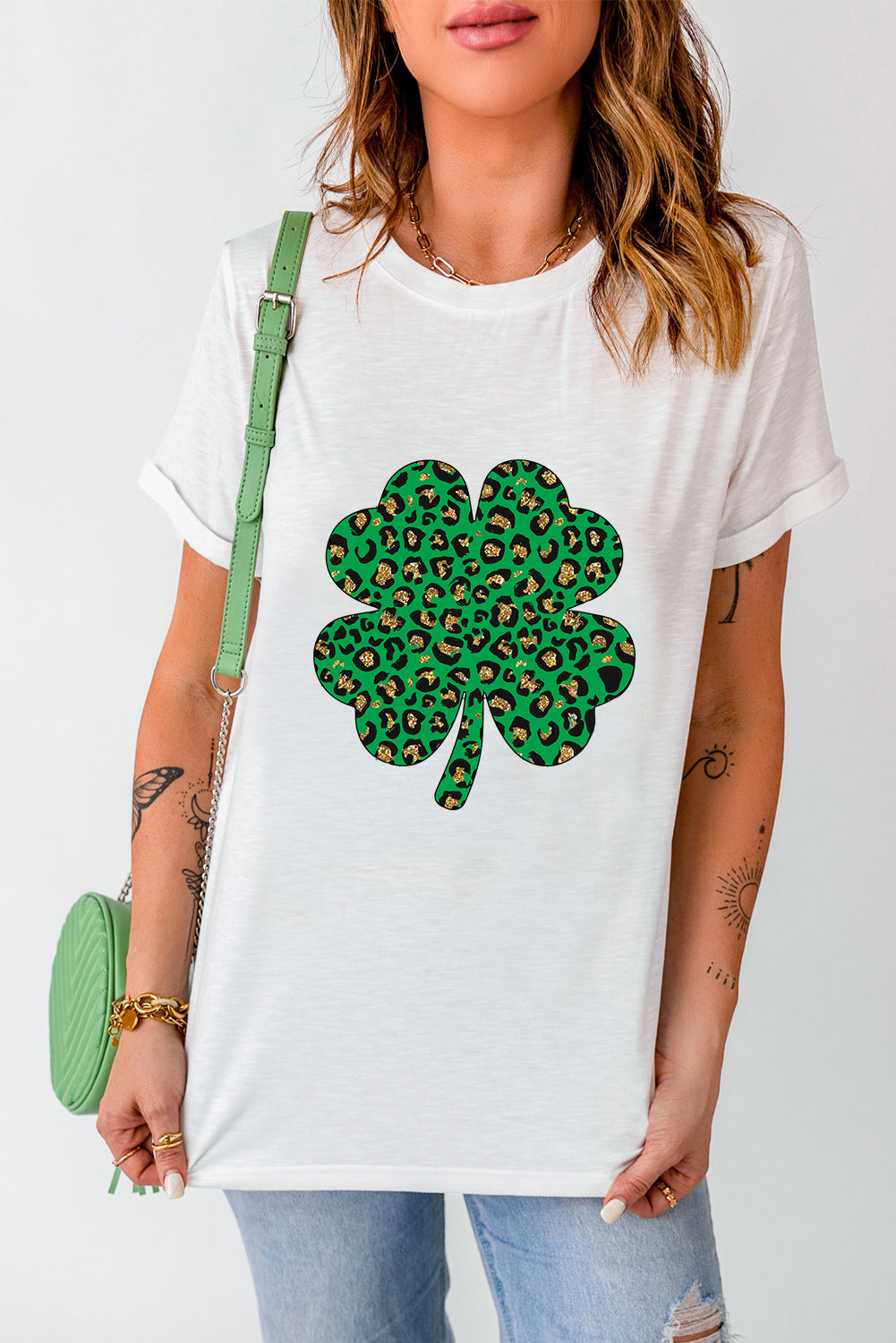 White Leopard Four Leaf Clover Graphic Tee featuring a stylish leopard print and four-leaf clover design.