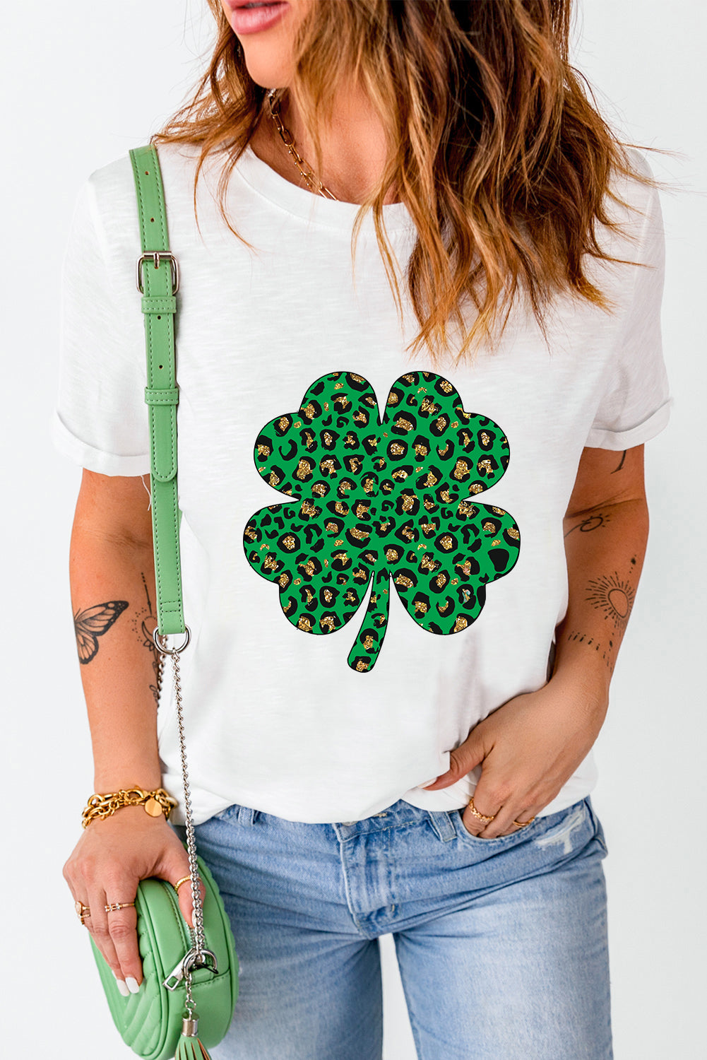 White Leopard Four Leaf Clover Graphic Tee featuring a stylish leopard print and four-leaf clover design.