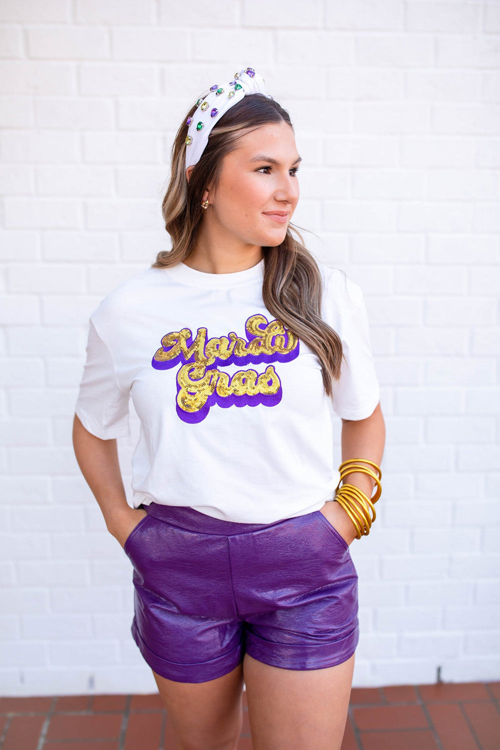 White Mardi Gras Sequin Graphic T-shirt featuring a bold design with shiny sequins, perfect for festive celebrations.