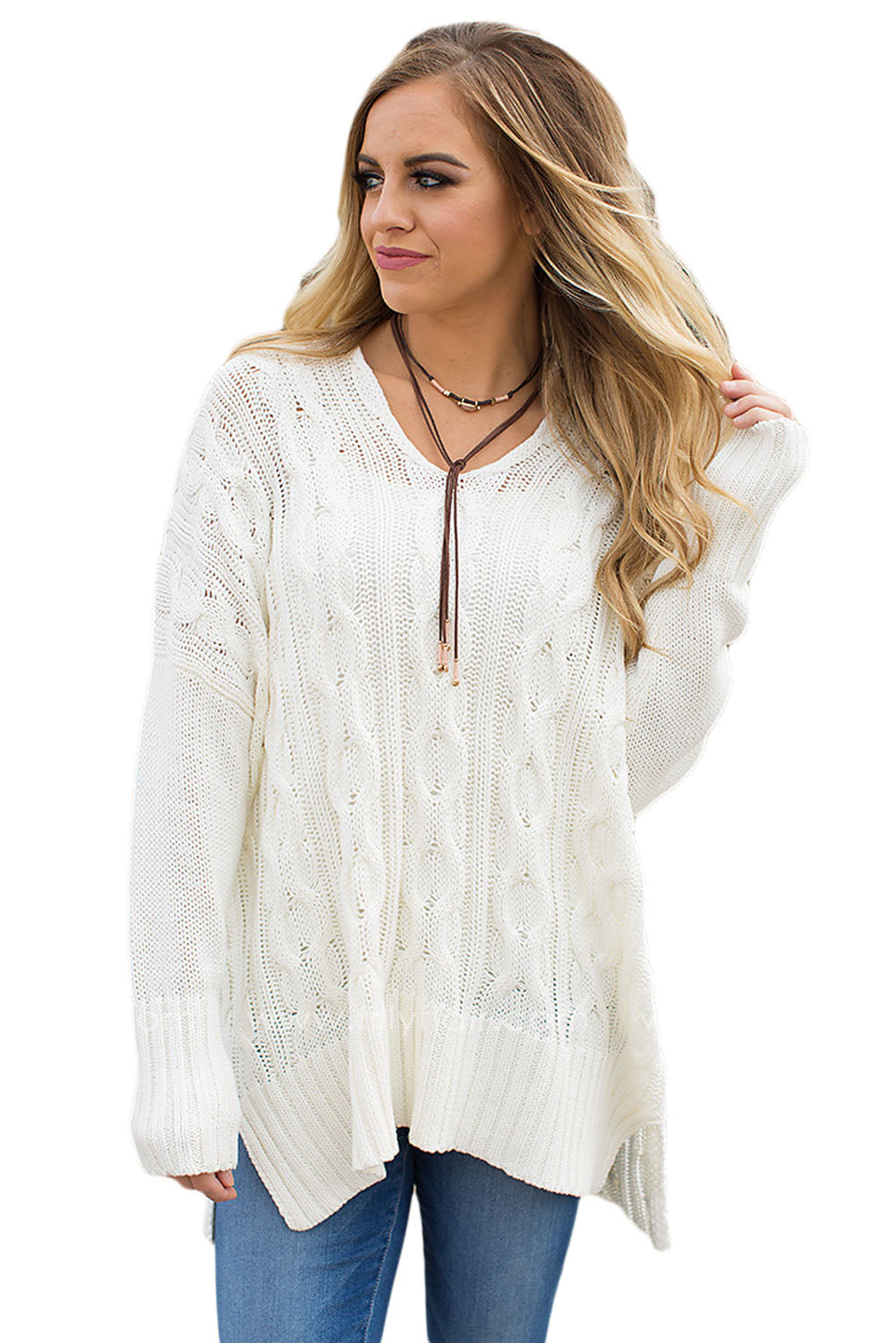 A stylish white oversized knit sweater with a deep v-neck and side slits, perfect for cozy wear.