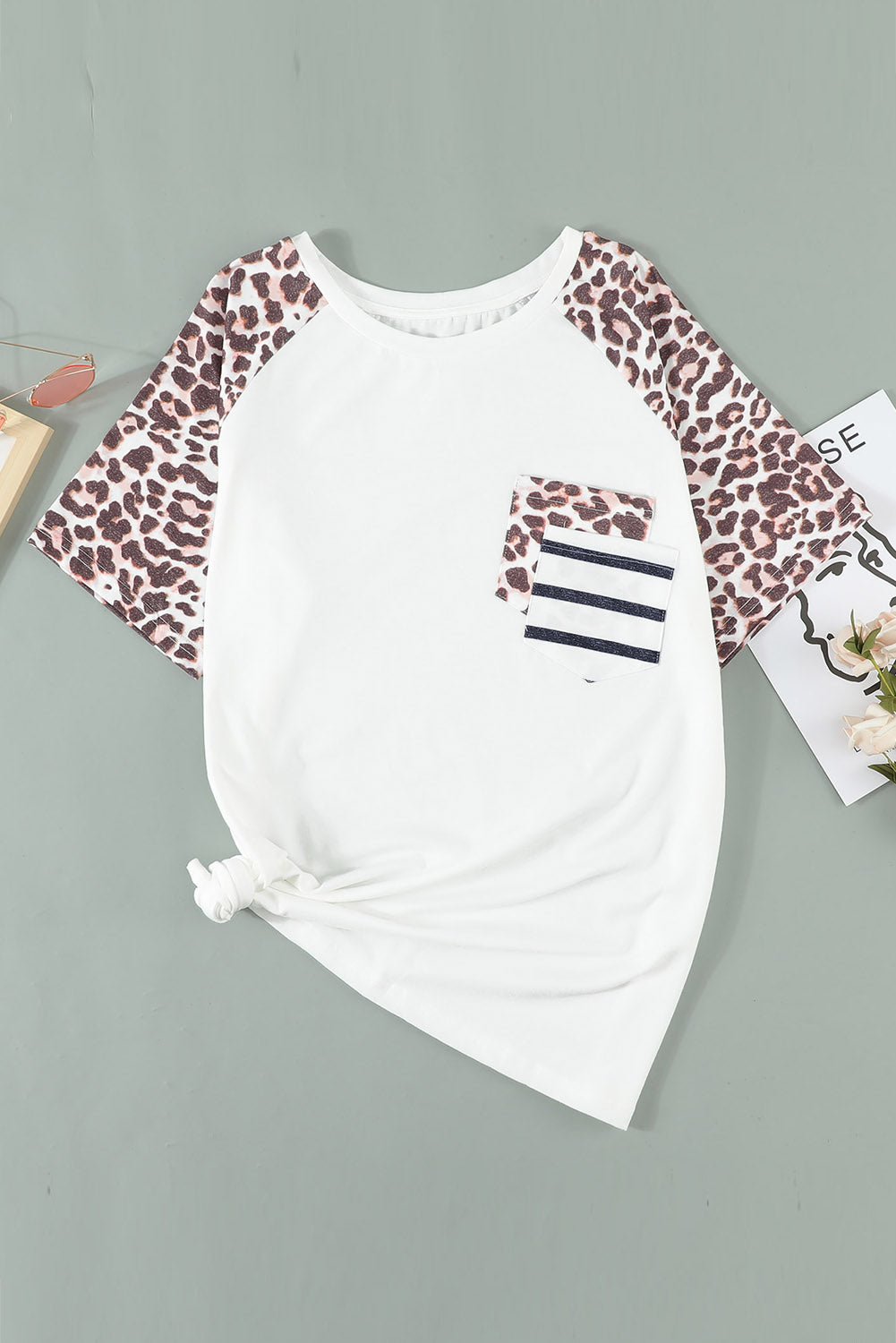 White plus size double pocket top featuring a chic leopard print and color block design, perfect for casual wear.