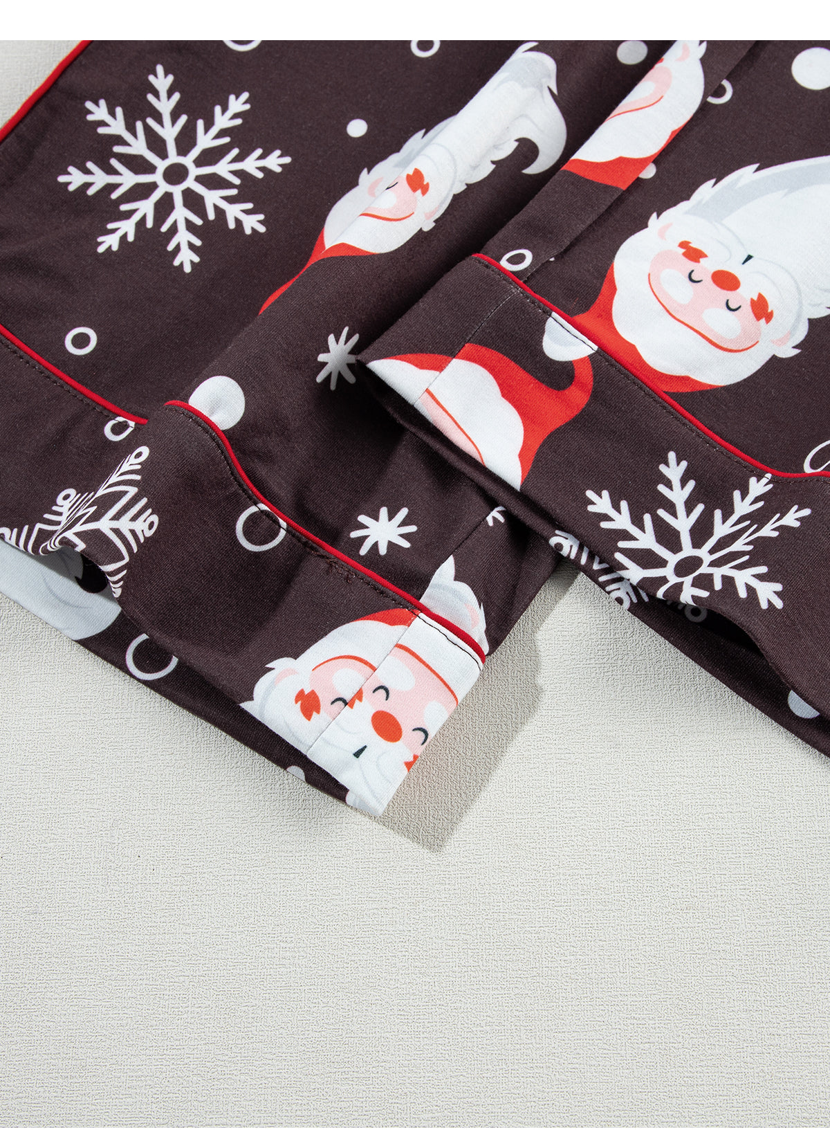 White Christmas pajama set featuring Santa Claus print on shirt and pants, perfect for holiday celebrations.