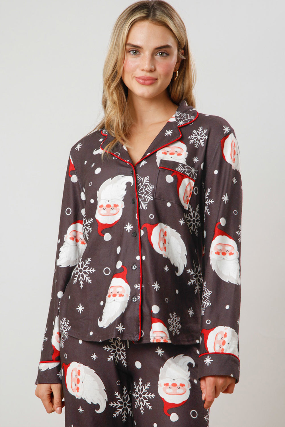 White Christmas pajama set featuring Santa Claus print on shirt and pants, perfect for holiday celebrations.