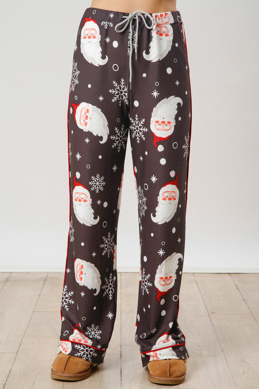 White Christmas pajama set featuring Santa Claus print on shirt and pants, perfect for holiday celebrations.