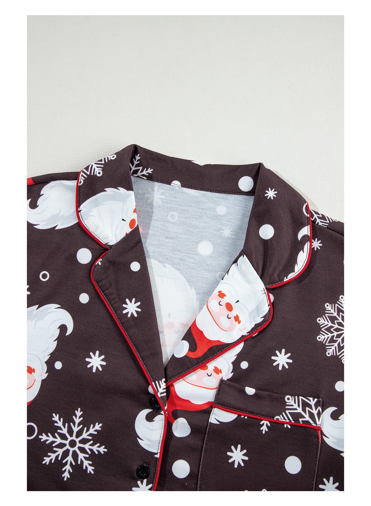 White Christmas pajama set featuring Santa Claus print on shirt and pants, perfect for holiday celebrations.