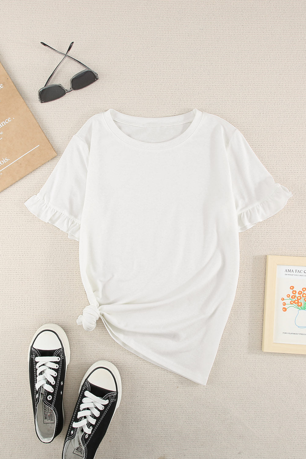 A stylish white short sleeve t-shirt featuring ruffled sleeves, perfect for casual wear.