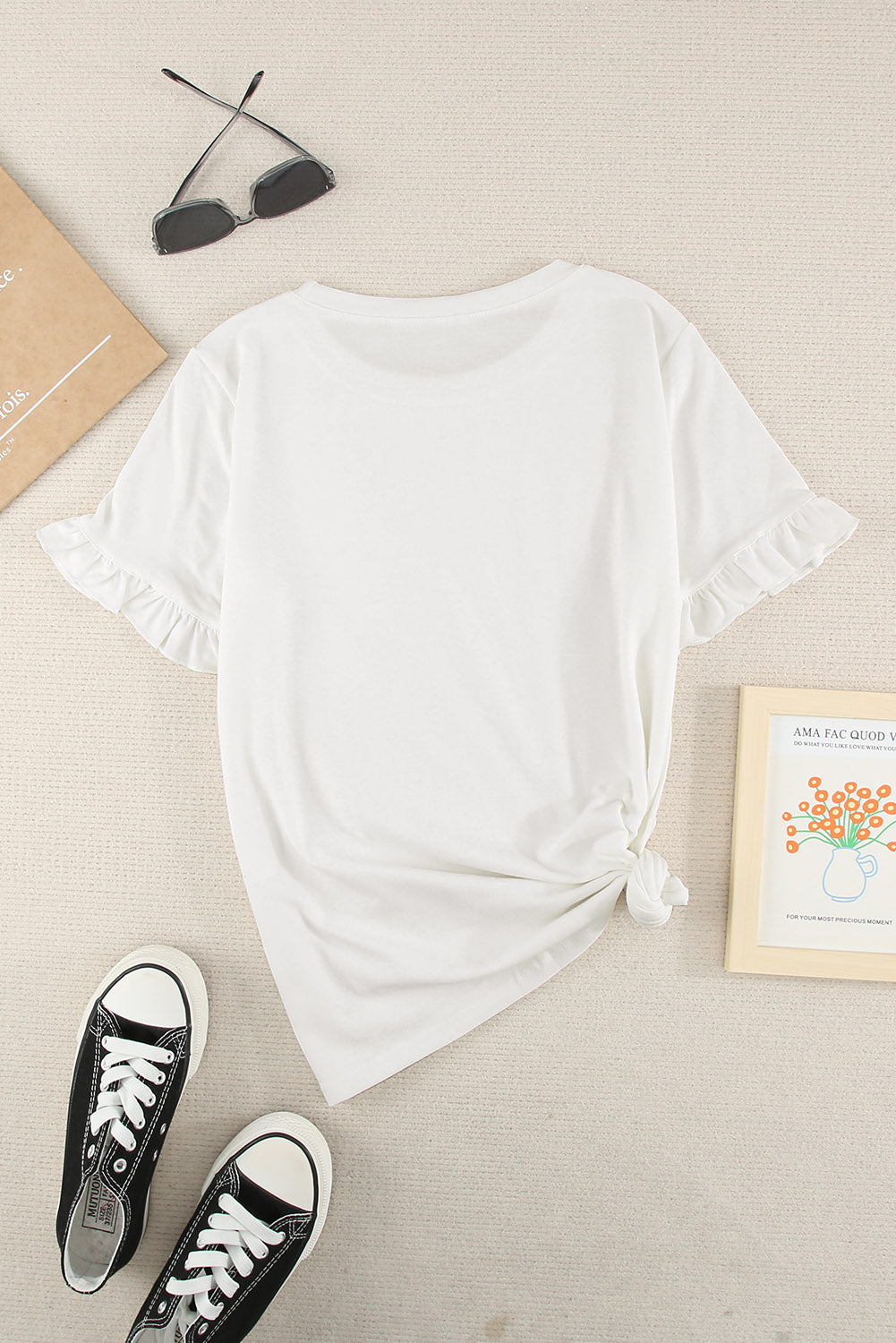 A stylish white short sleeve t-shirt featuring ruffled sleeves, perfect for casual wear.