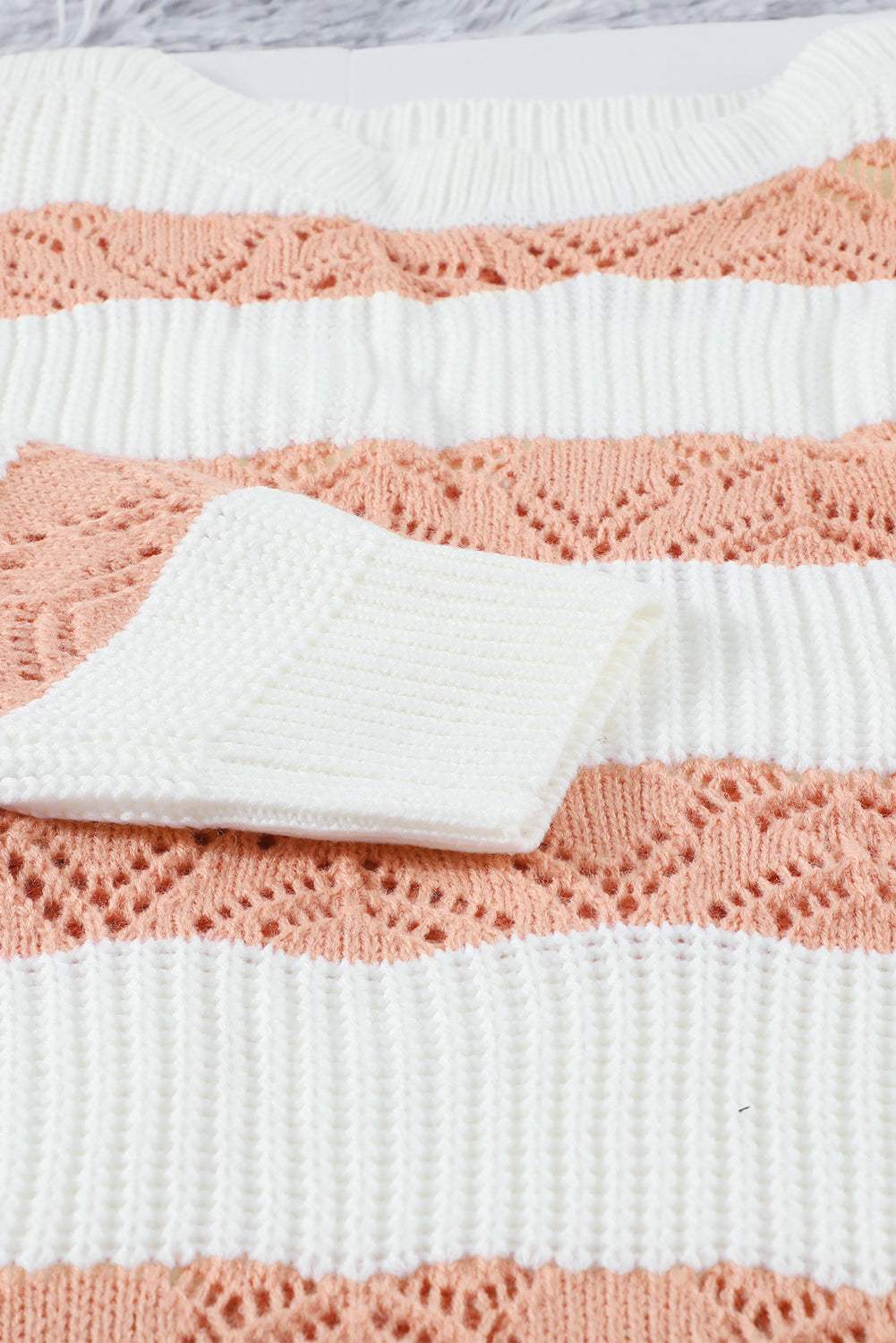 A stylish White Striped Colorblock Knit Sweater featuring a modern design with soft fabric, perfect for casual wear.