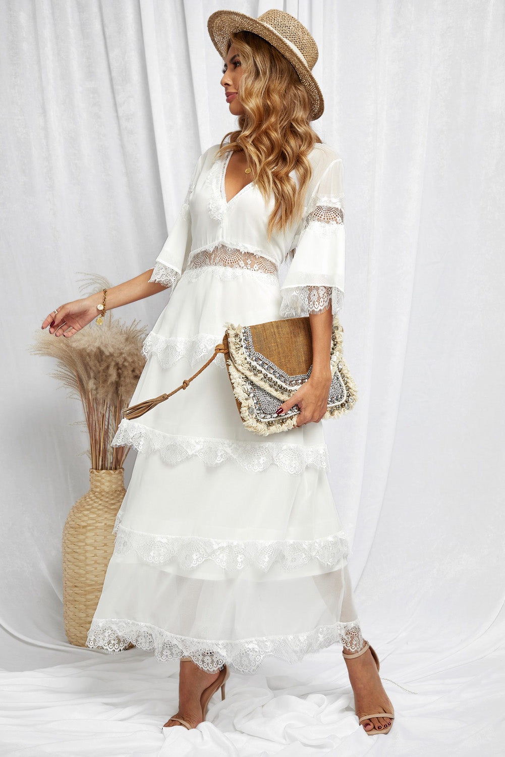 A beautiful White Swiss Dot Print See-through Lace Patch Layered Long Dress displayed elegantly, showcasing its delicate lace details and flowing silhouette.