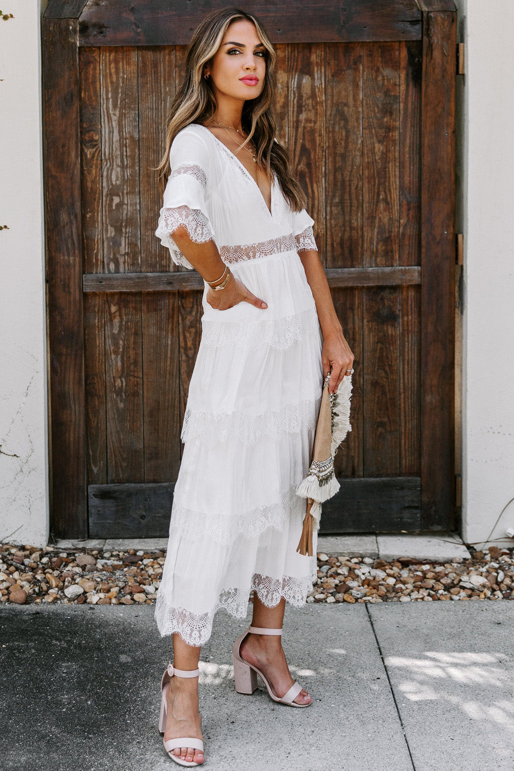 A beautiful White Swiss Dot Print See-through Lace Patch Layered Long Dress displayed elegantly, showcasing its delicate lace details and flowing silhouette.