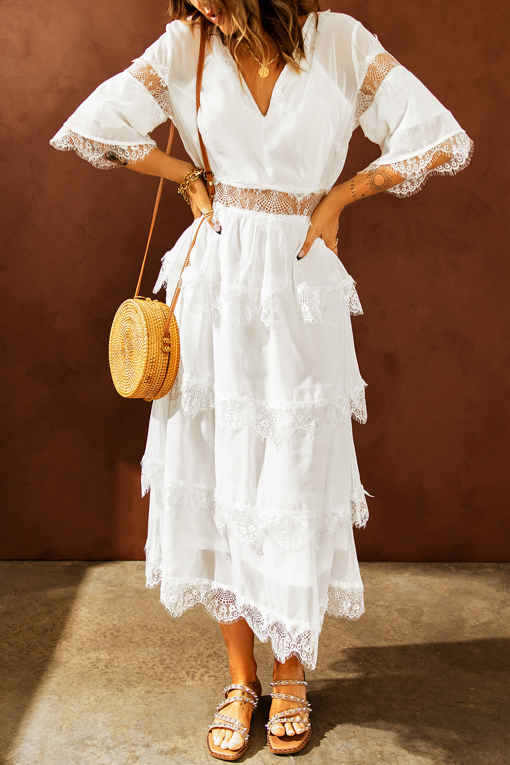 A beautiful White Swiss Dot Print See-through Lace Patch Layered Long Dress displayed elegantly, showcasing its delicate lace details and flowing silhouette.