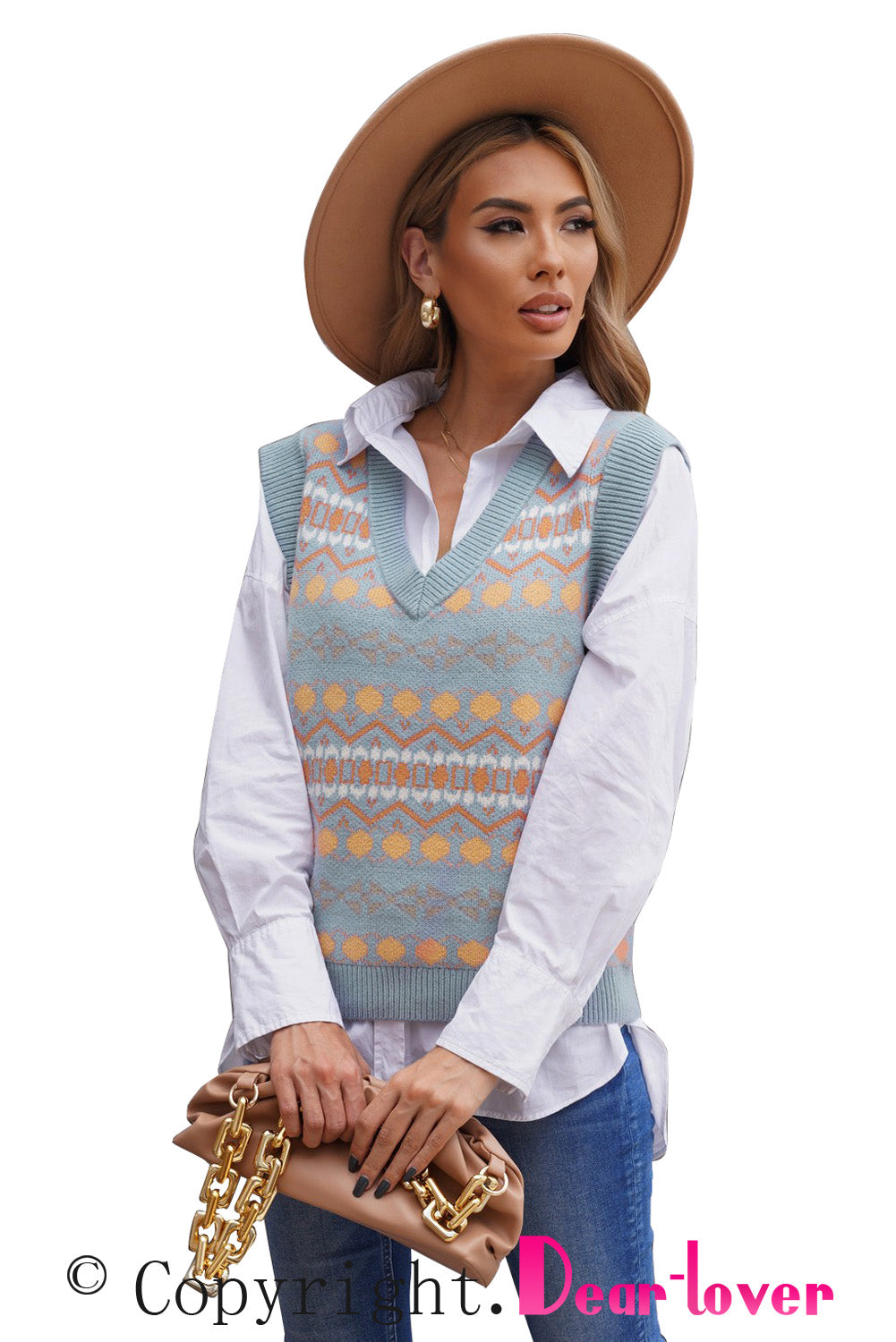 A stylish white knitted sweater vest featuring a unique tribal print design, perfect for layering during colder months.