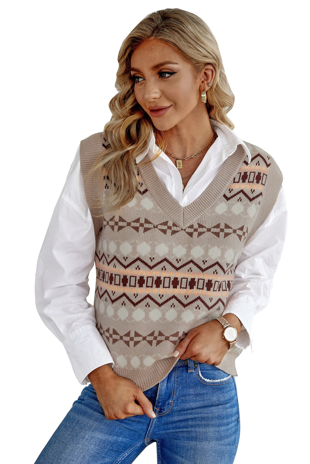 A stylish white knitted sweater vest featuring a unique tribal print design, perfect for layering during colder months.