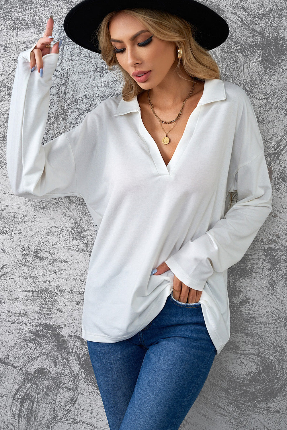 A stylish white turn-down V neck long sleeve top displayed on a mannequin, showcasing its elegant design and comfortable fabric.