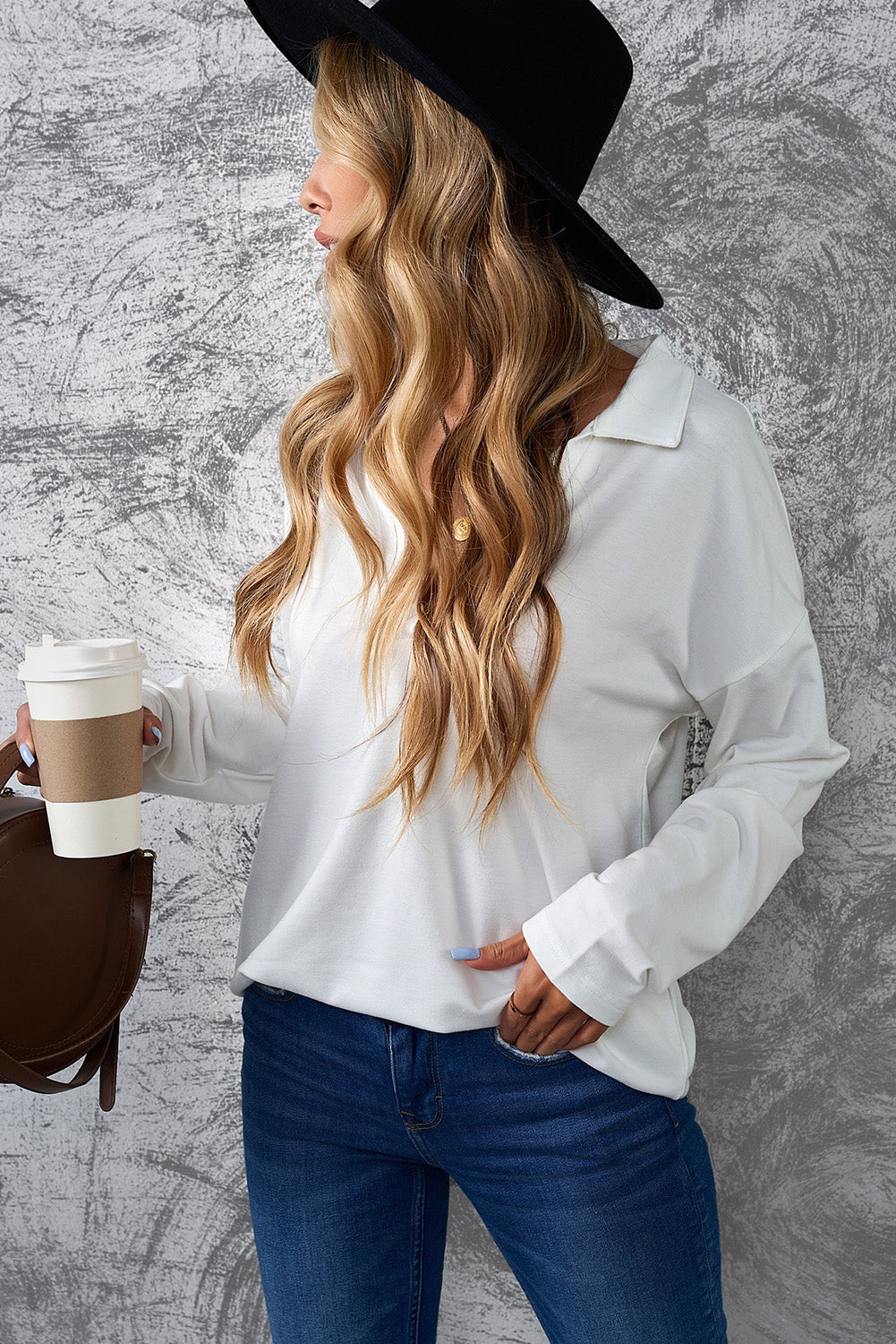 A stylish white turn-down V neck long sleeve top displayed on a mannequin, showcasing its elegant design and comfortable fabric.