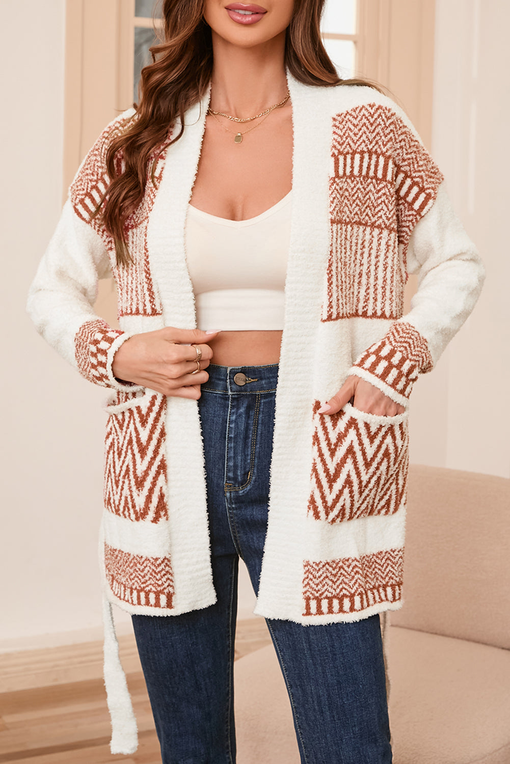 A stylish White Western Aztec Belted Cardigan featuring intricate Aztec patterns, perfect for layering and adding a boho chic touch to outfits.