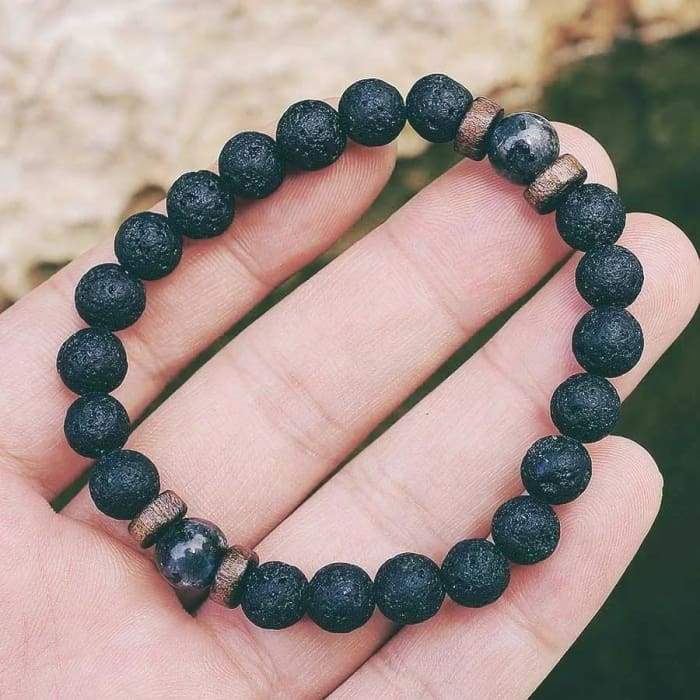 Wood and Lava Stone Essential Oil Bracelet in gray, featuring natural lava stones and wooden beads, perfect for aromatherapy.