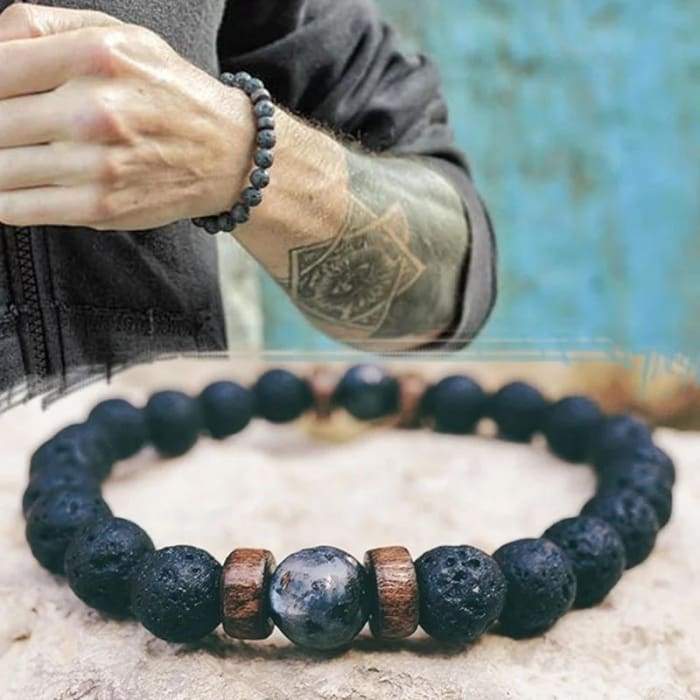 Wood and Lava Stone Essential Oil Bracelet in gray, featuring natural lava stones and wooden beads, perfect for aromatherapy.