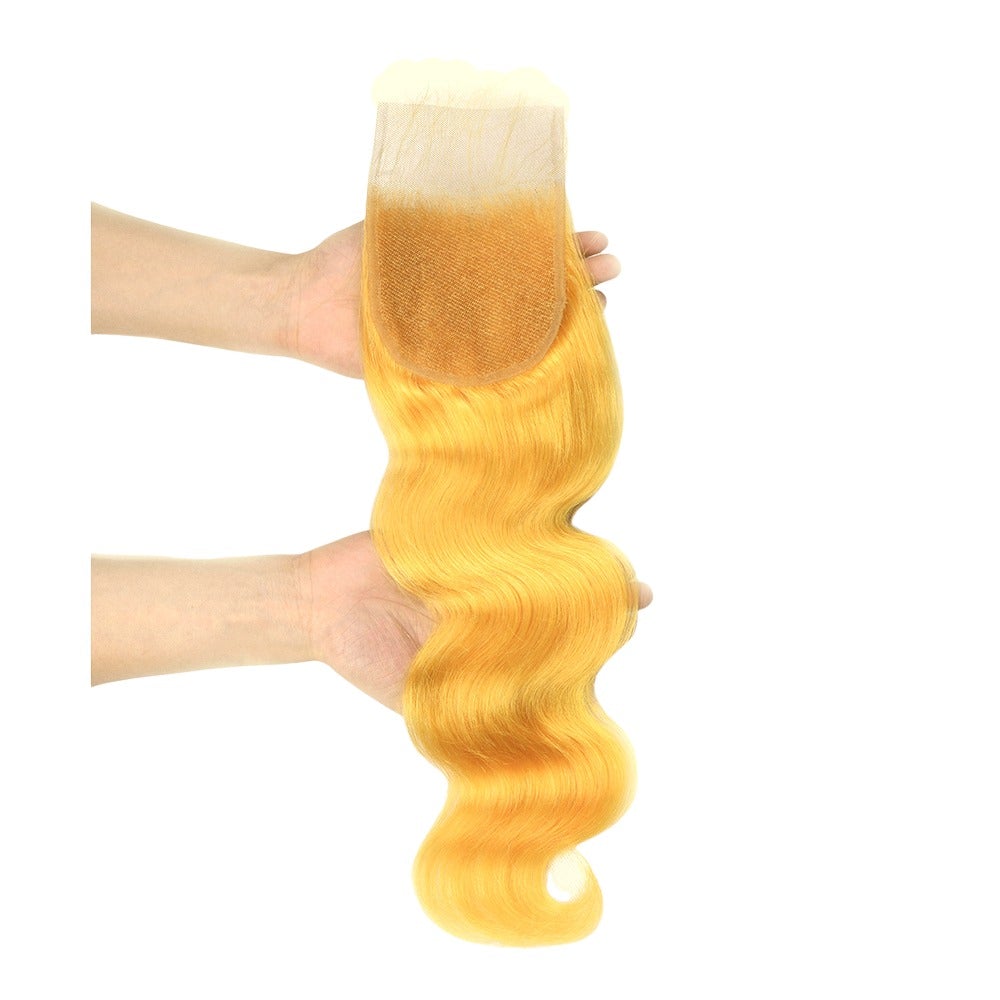 Vibrant yellow body wave hair bundles with closures, showcasing high-quality 10A grade human hair.