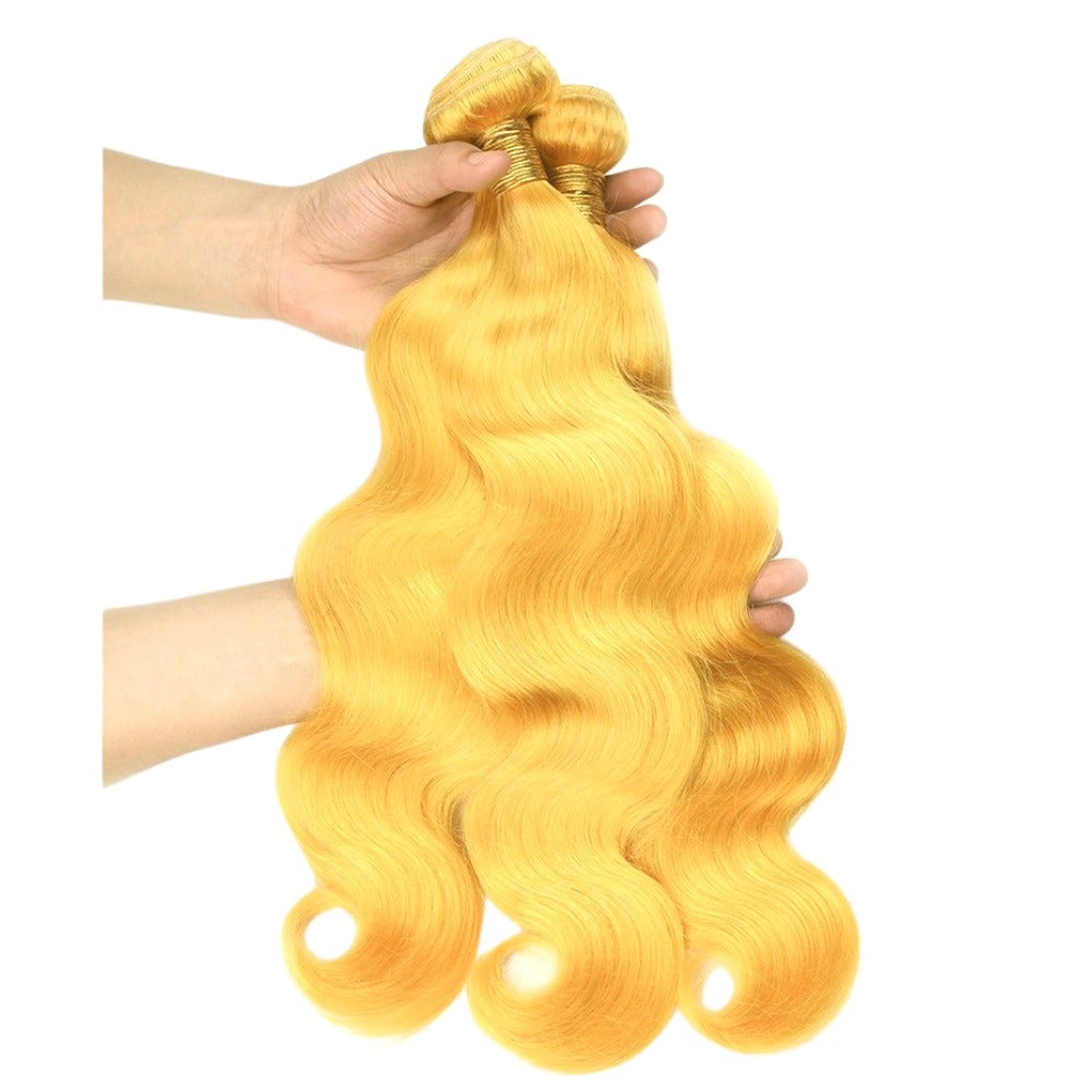 Vibrant yellow body wave hair bundles with closures, showcasing high-quality 10A grade human hair.