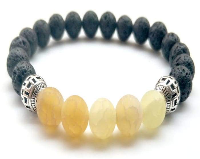 Yellow Lava Stone Essential Oil Bracelet showcasing its vibrant color and porous texture, ideal for absorbing essential oils.